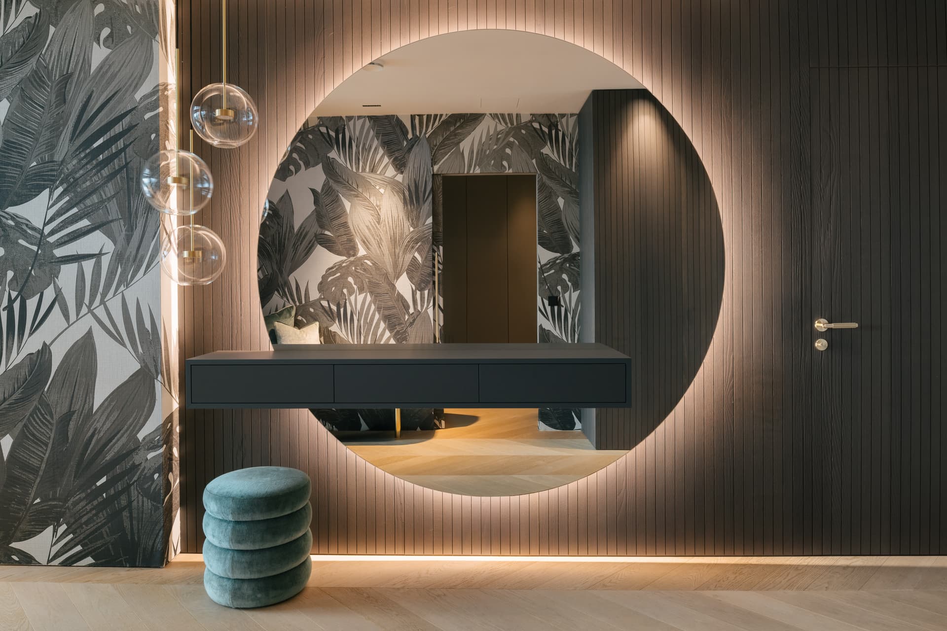 Hallway with custom flooring and lighting.